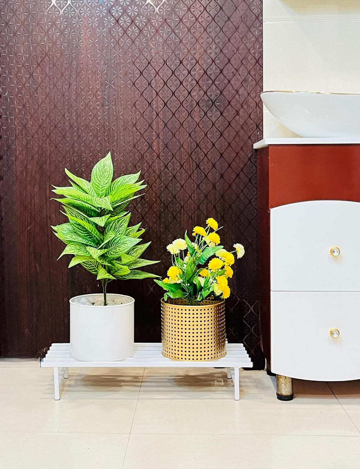 White plant stand with flowers